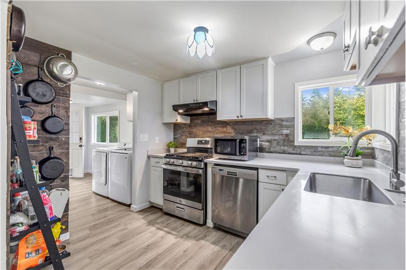 The washer and dryer are included. The back door leads to the garage.