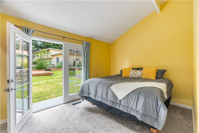 Next is the primary bedroom. This bedroom has beautiful French doors that lead to the backyard.