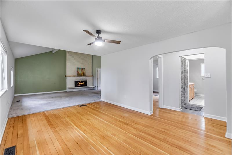 Entering the home, you are greeted by restored original wood floors.