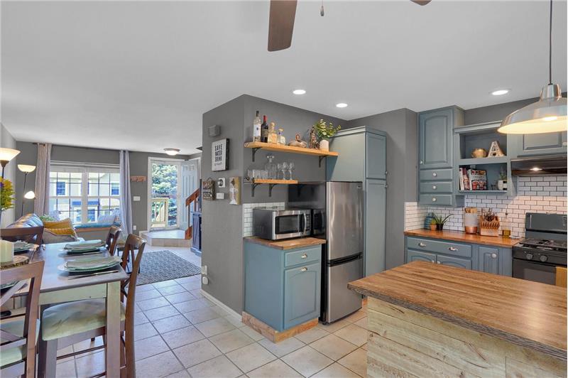 Tiled floors are featured through the main level and recessed lighting in the Kitchen.