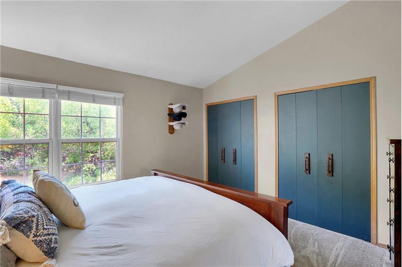 The upper-level vaulted Master Bedroom has 2 generous closets.