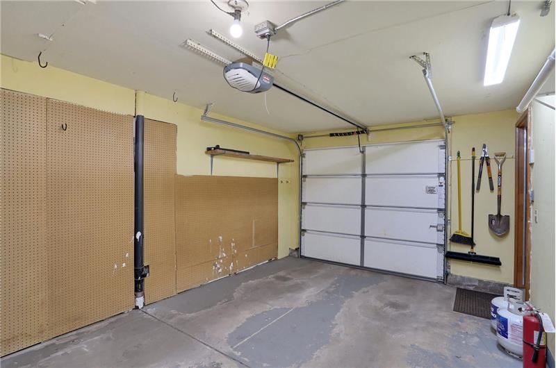 1-car attached garage with garage door opener.