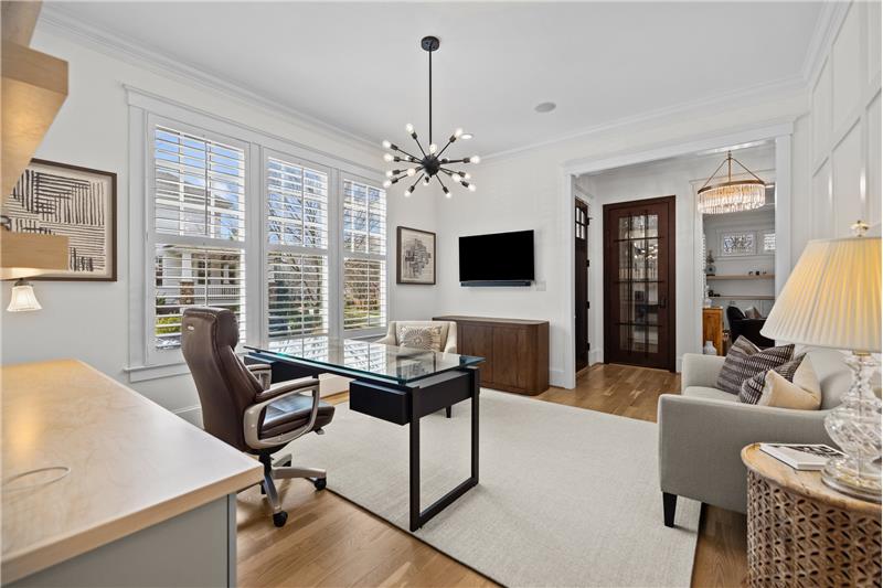 Office can also be used as formal dining room, library, music room. Behind the glass door in foyer is a 350-bottle wine closet.