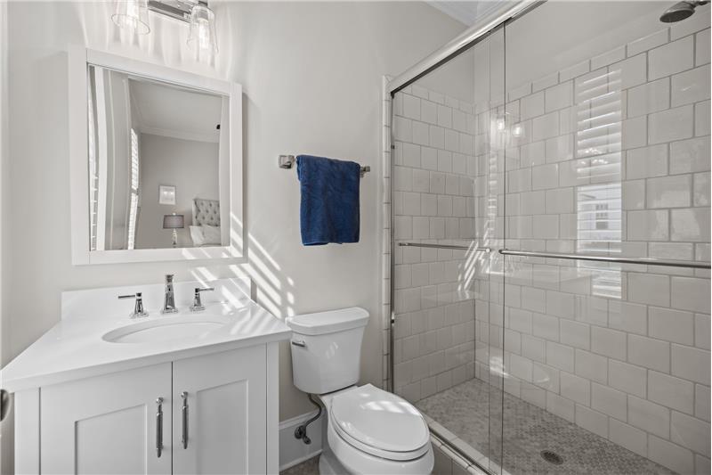 Updated main floor, en-suite bathroom with large step-in shower with tile surround.