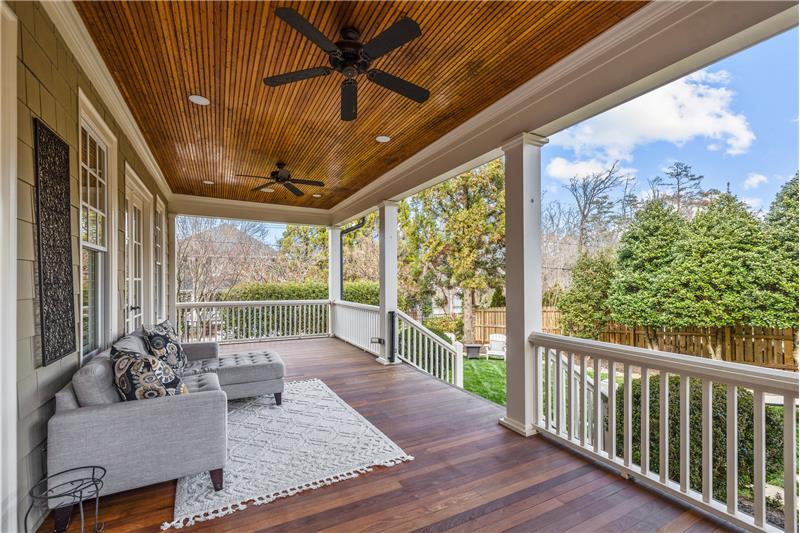 Spacious covered back porch with Brazilian wood, recently refinished.