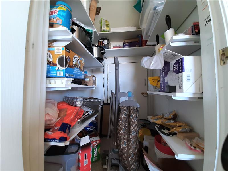 Storage Space Abound! Walk-in Pantry accesses additional space under the staircase!