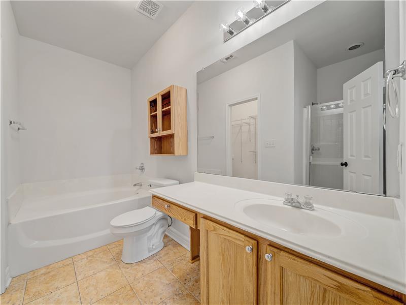 Primary bath features soaking tup and separate shower