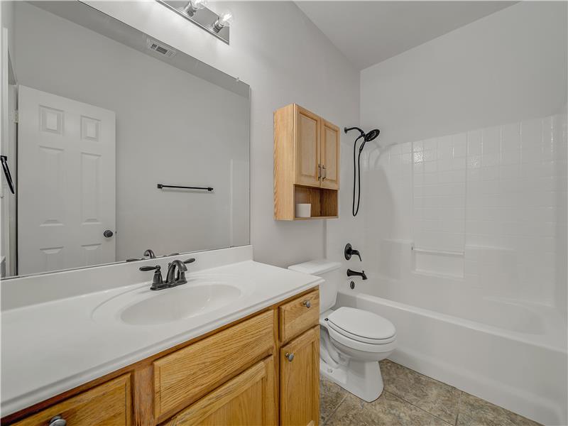 Second bathroom with a full tub