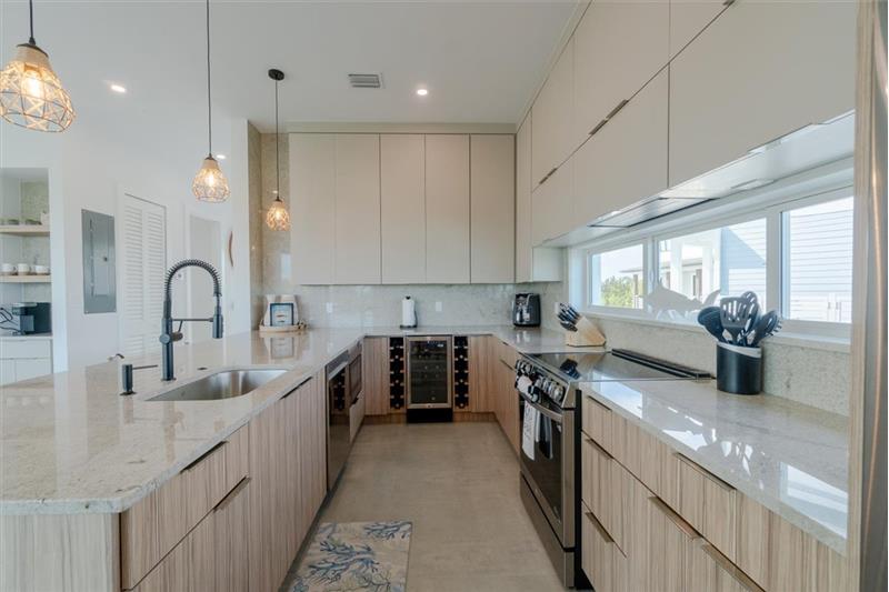 Fully stocked modern kitchen with all-new appliances and cookware.