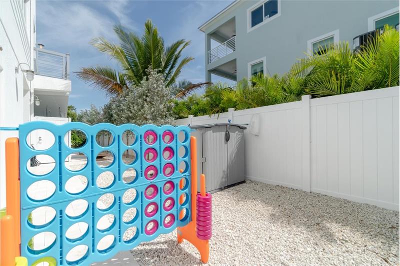 Outdoor games for your enjoyment Cornhole, giant connect-4, and a 5-hole putting green.