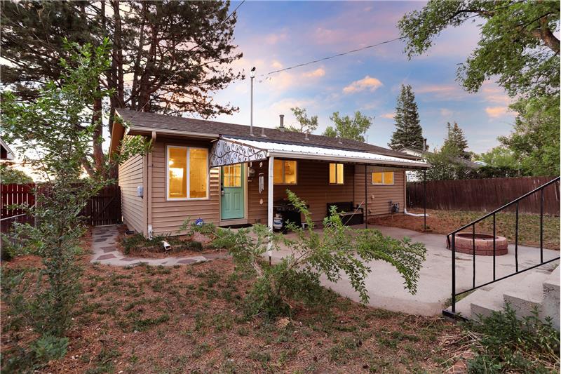 Fenced Lot with Covered Patio, Fire Pit, and Storage Shed