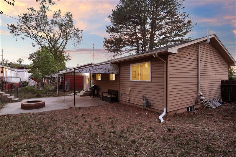 Sunset Views of Fenced Lot with Covered Patio, Fire Pit and Storage Shed