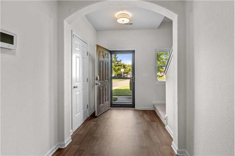 Spacious foyer with LVP flooring, new light fixture