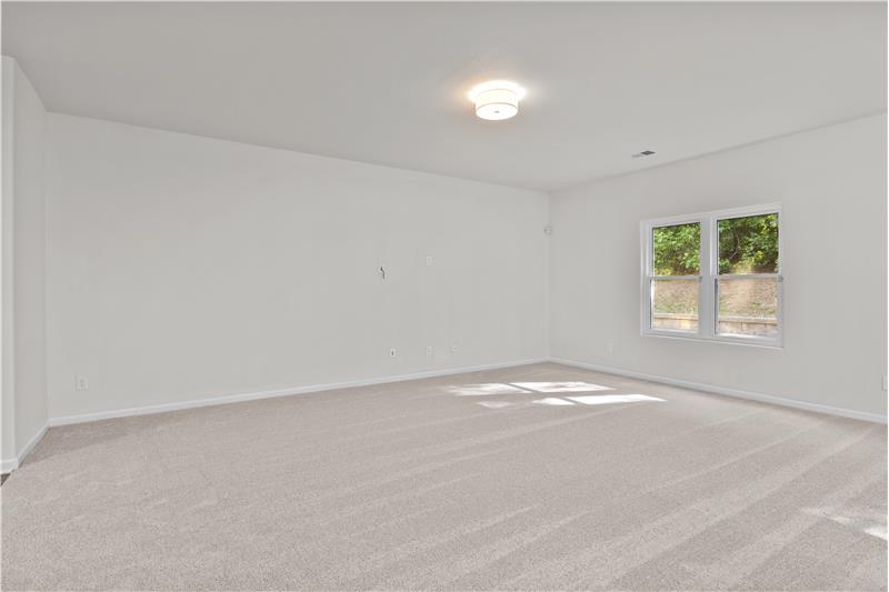 Great room with plenty of room for seating, large screen TV