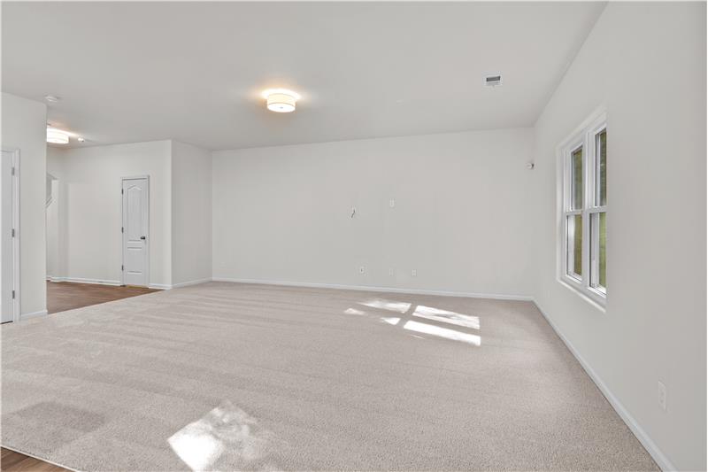 Generously proportioned great room with open sight lines to foyer