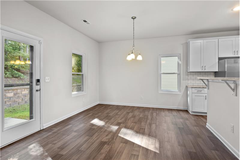 Dining area has open sight lines to kitchen and great room