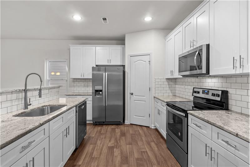 Kitchen features Whirlpool stainless steel appliances