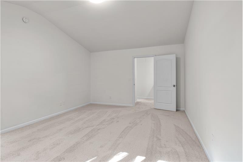 Primary bedroom has plenty of space for king-size bed, larger dressers