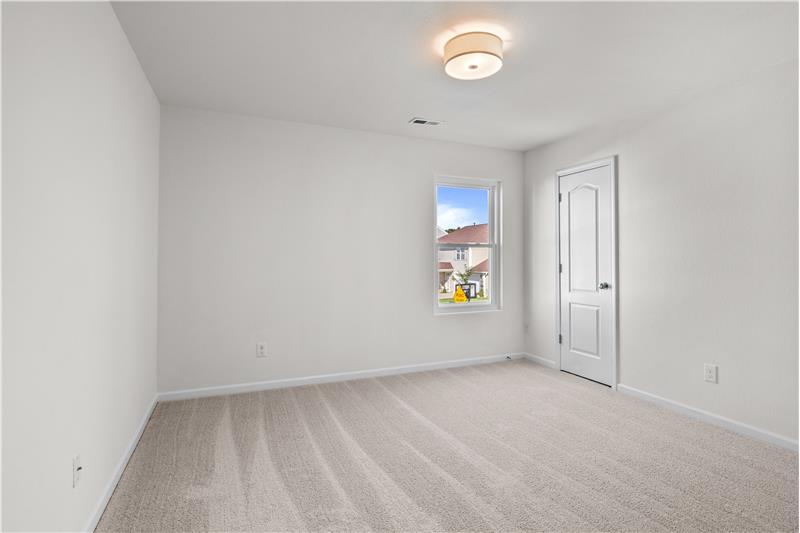 One of three additional bedrooms on second floor