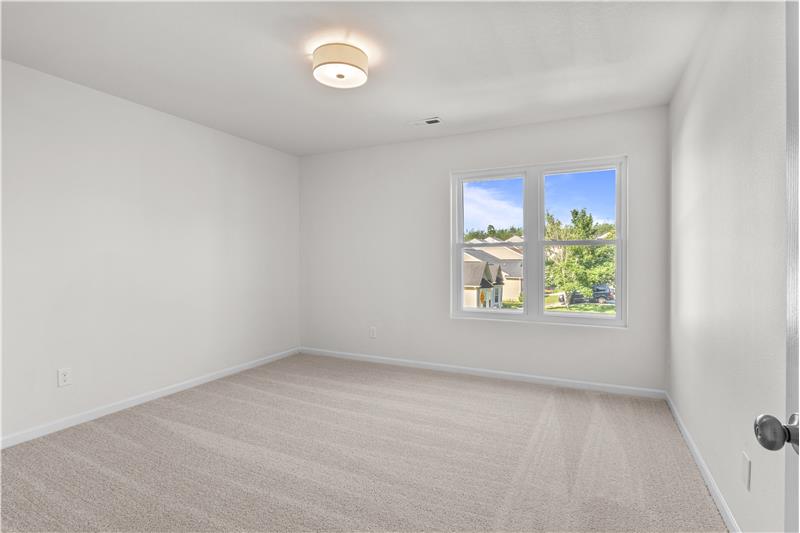 One of three additional bedrooms on second floor