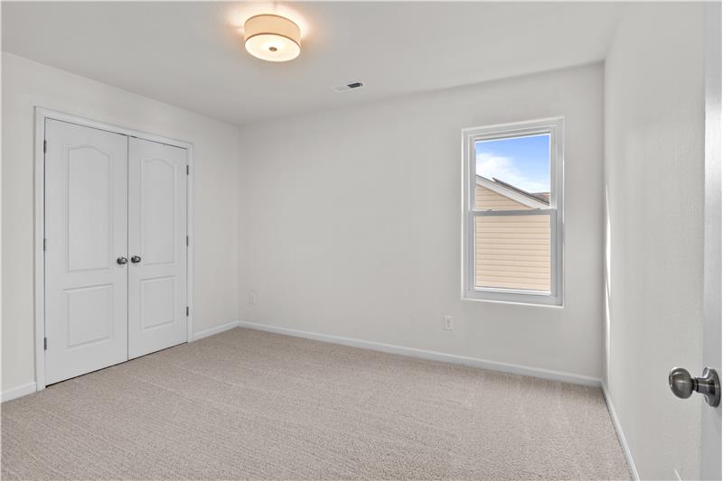 One of three additional bedrooms on second floor