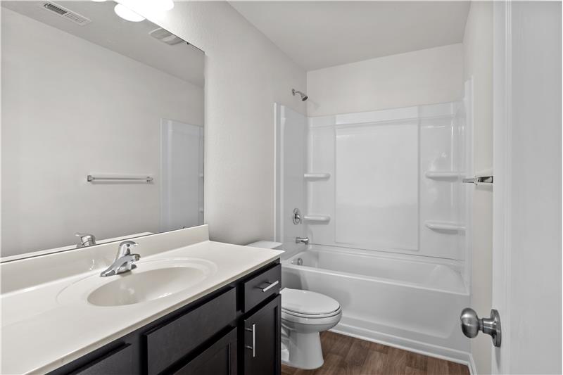 Hall bath on second floor: extended vanity, tub/shower combination