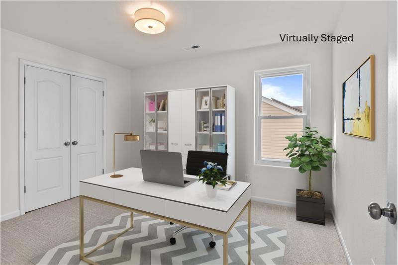 Bedroom virtually staged as a home office.