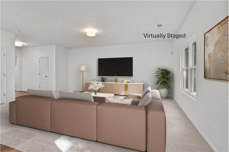Virtually staged great room. Space for cozy movie nights, relaxing, entertaining