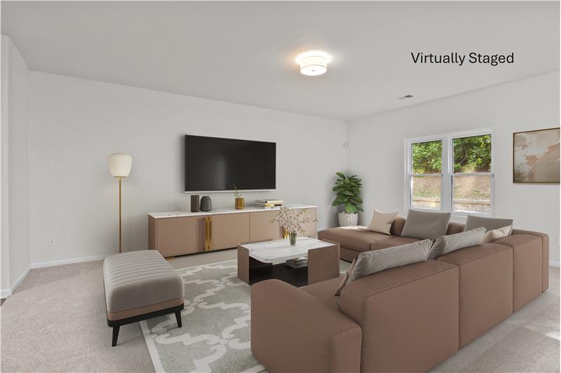 Virtually staged great room. Space for multiple seating arrangements