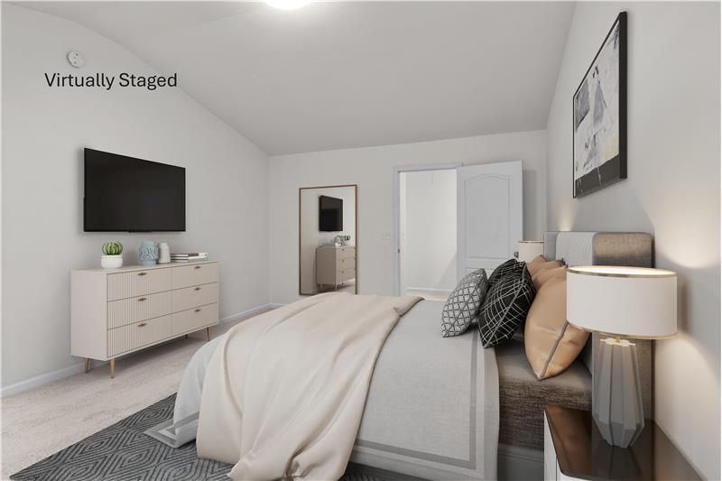 Virtually staged serene and spacious primary bedroom is a true retreat