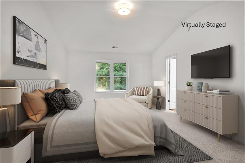Virtually staged primary bedroom with room for sitting area