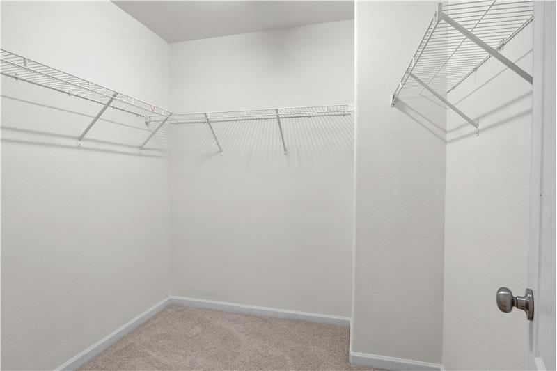 Walk-in closet in primary suite