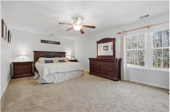 HUGE primary bedroom with view of yard