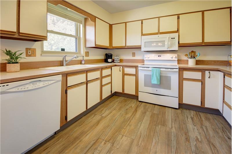 Kitchen with Cabinet Pantry, Refaced Cabinets, and Newer Appliances