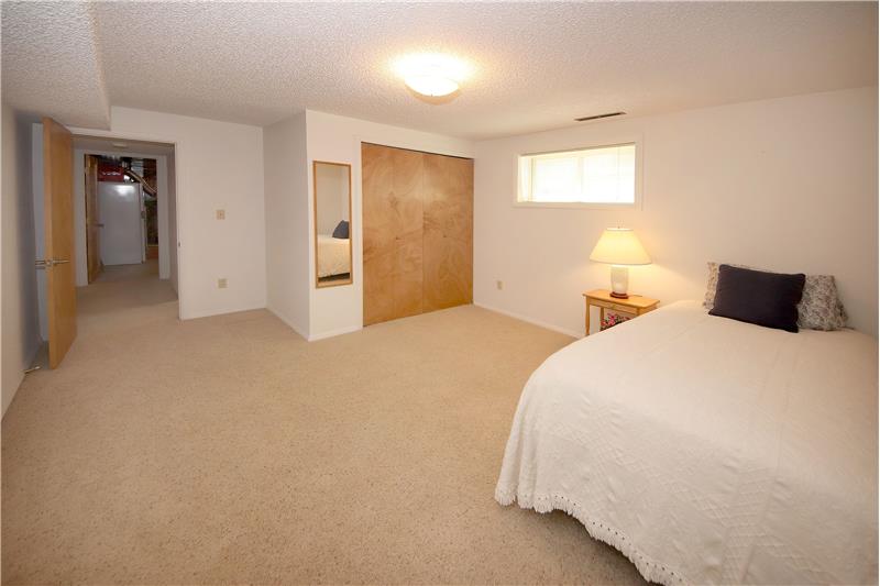 Basement Bedroom #4 has Neutral Carpet
