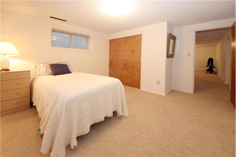 Basement Bedroom #5 has Neutral Carpet