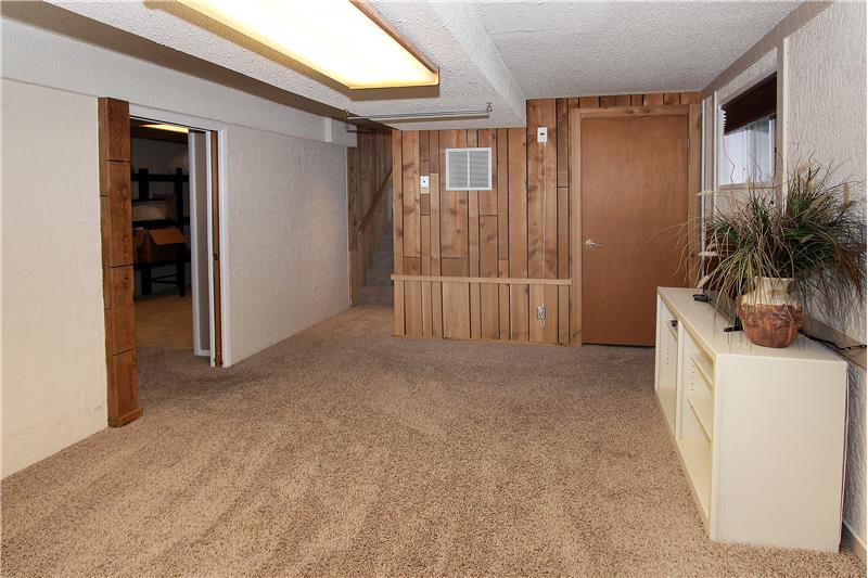 Second family room with pocket door near bedroom and office/storage room