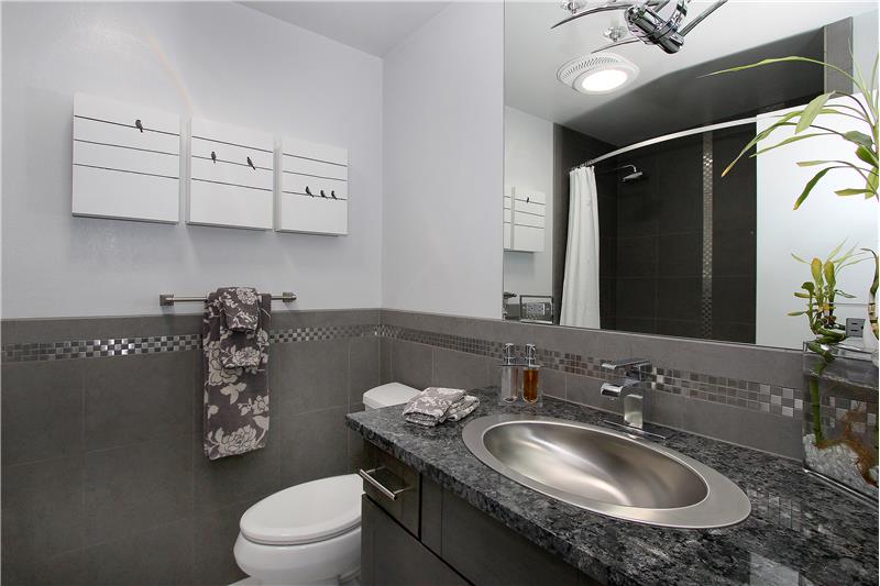 Upper bath with tile, granite counter top, Kohler sink, and maple vanity