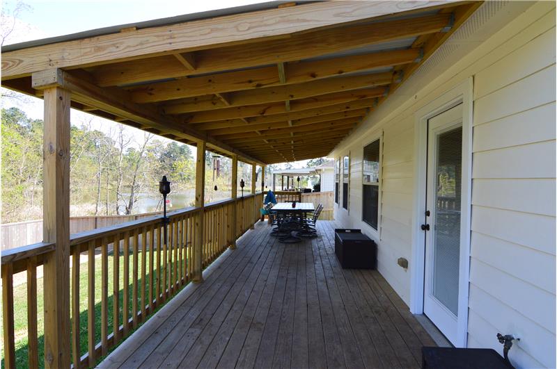 Covered Wood Deck with a view of the neighborhood lake!