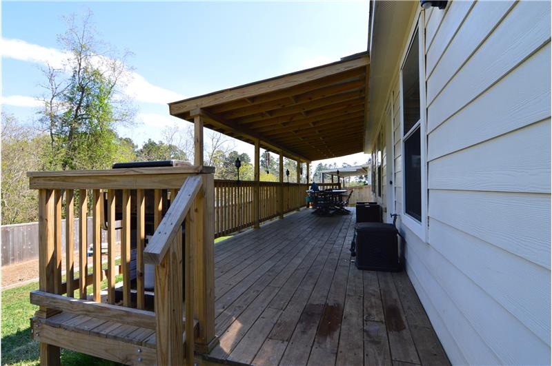 Another view of the covered wood deck with room for your grill.
