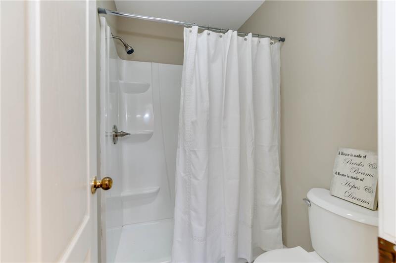 Shower and commode in separate area