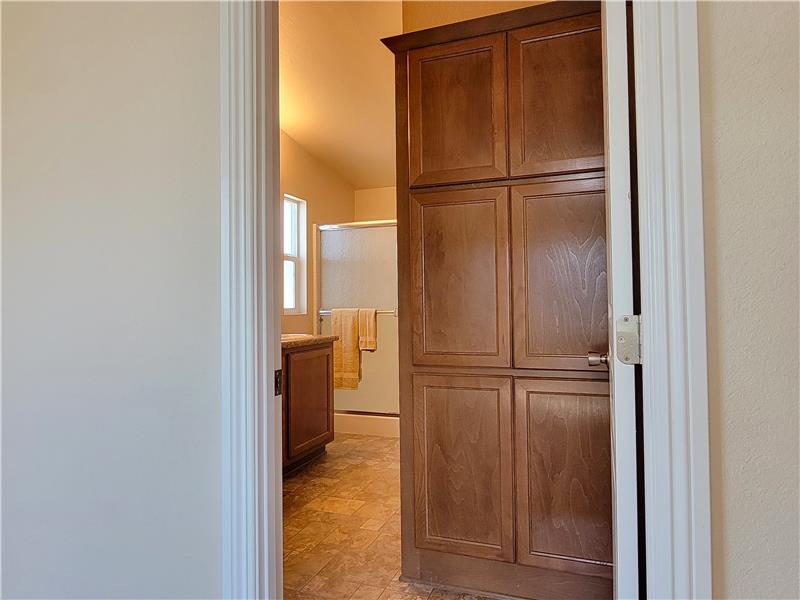 The Primary Bath has Linen Closet AND expansive open shelving (not pictured).