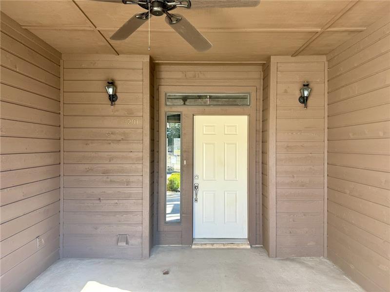 Large covered patio by front door