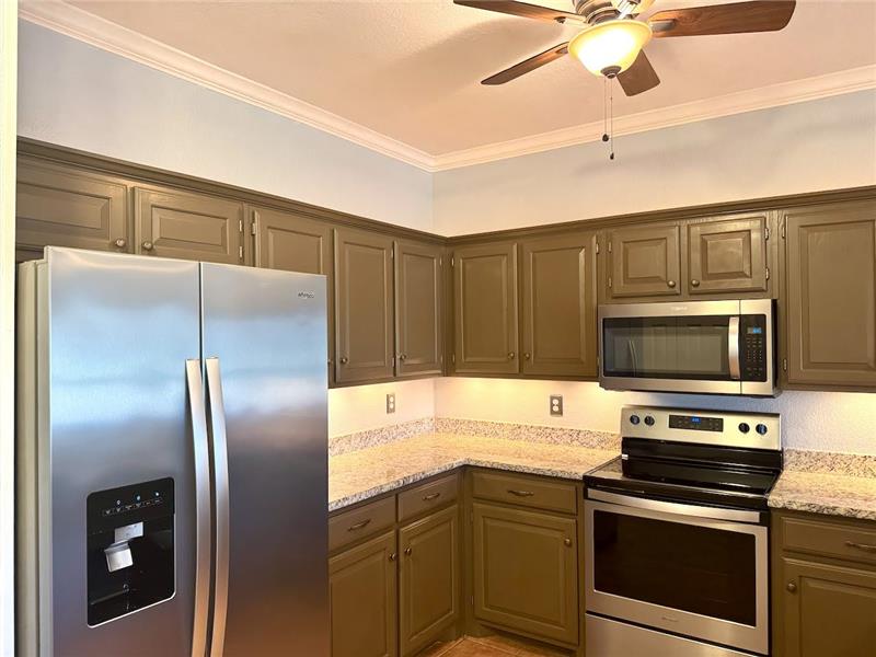 Kitchen featuring granite counter tops, and stainless steel appliances