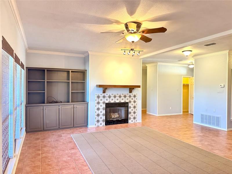Large living space featuring wood burning fireplace