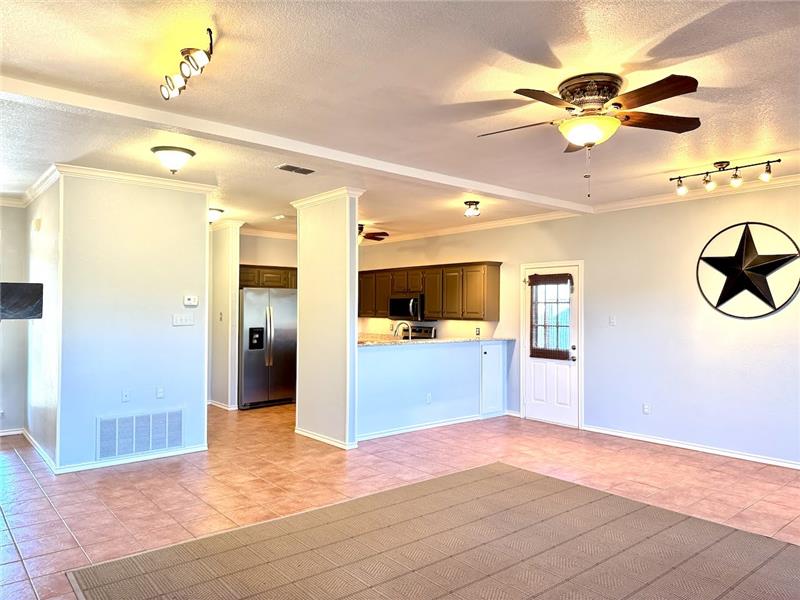Kitchen nook area has a side door leading to another open patio