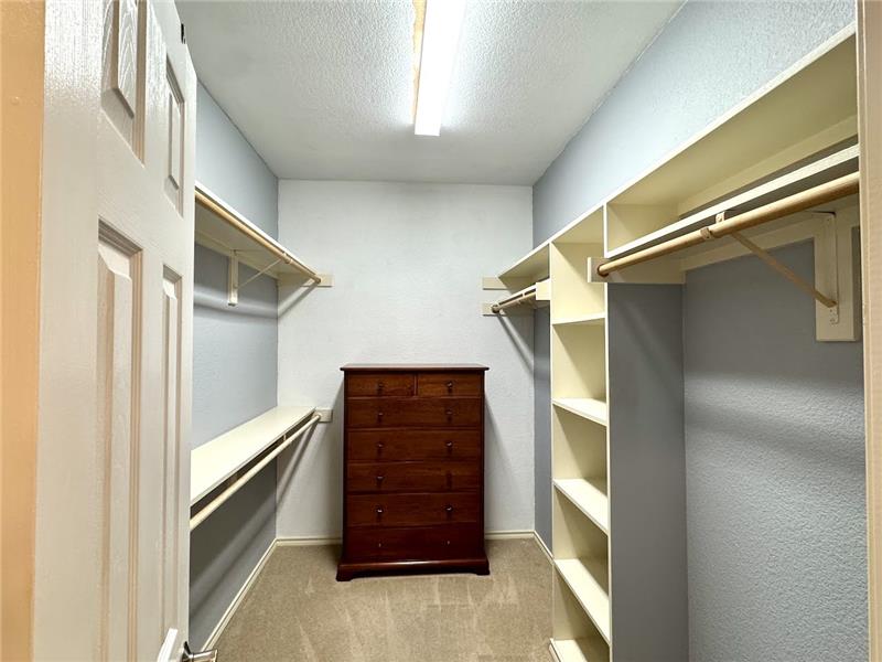 Primary bedroom bathroom features huge walk in closet