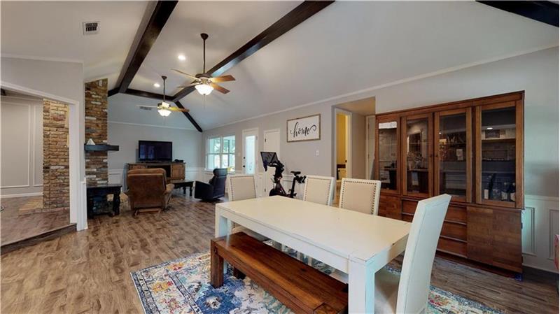 Exposed wood beam ceilings and open concept