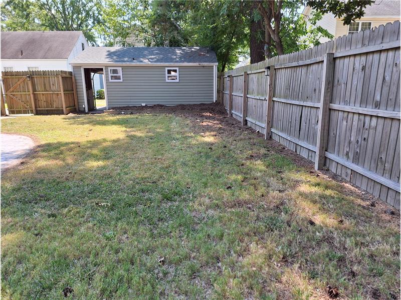 Back Yard with Detached Garage Entrance