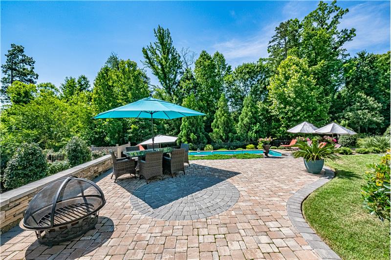 You'll love dining al fresco on the large patio surrounded by lush landscaping and overlooking the pool.
